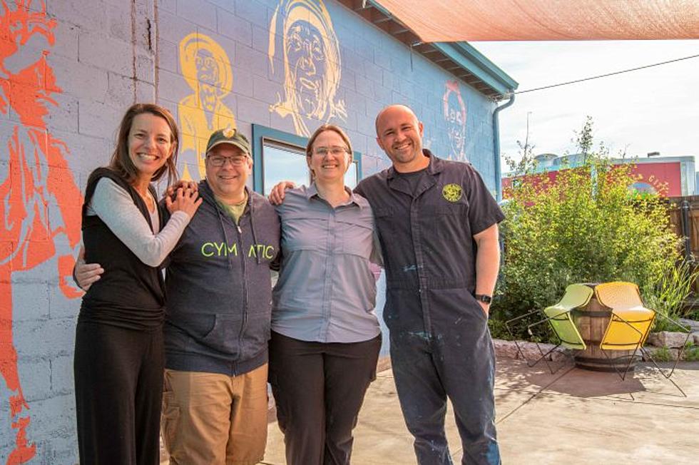 Current Imagine Nation Brewing owners Fernanada and Robert on either side of Cymatic Owner/New Imagine Nation Brewing owners Tim and Annie Graham 